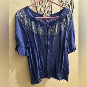 Tory Burch top.